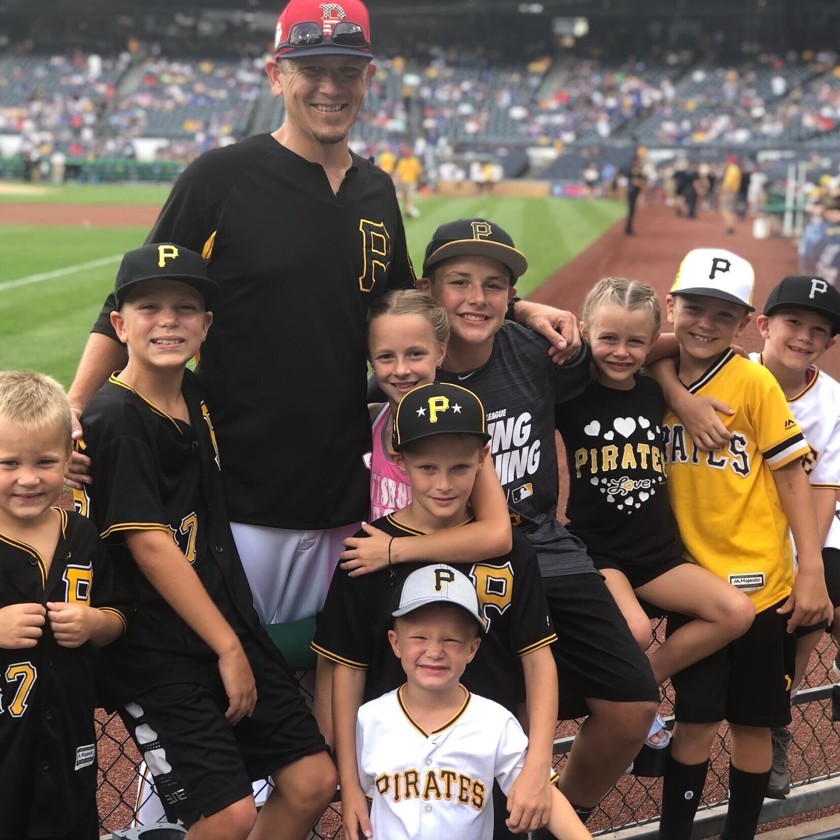 Justin Meccage with the kids at a Pirates game